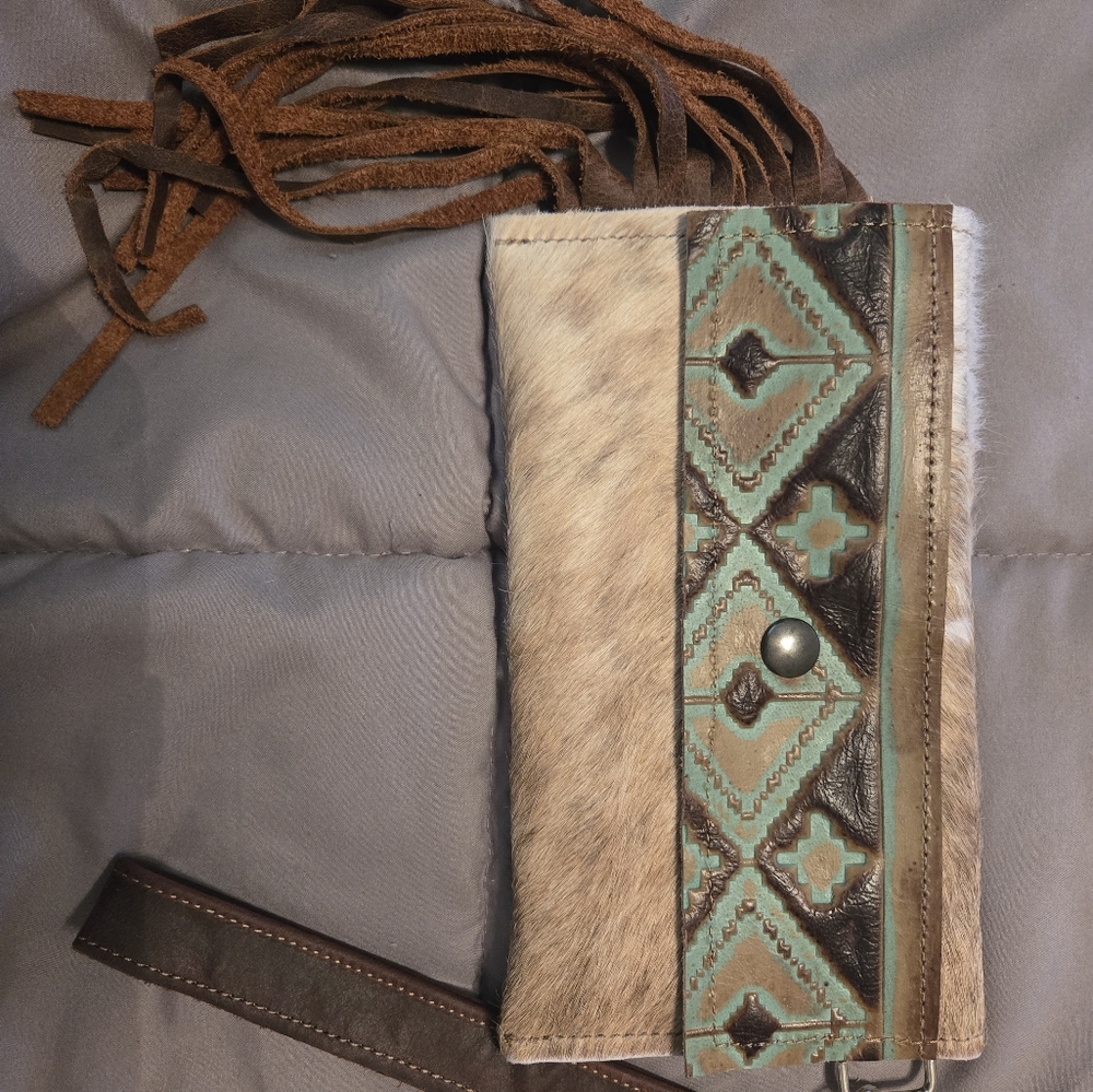 Cowhide. Leather wristlet
